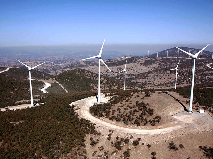 Aerial view of wind turbines and the surrounding project area